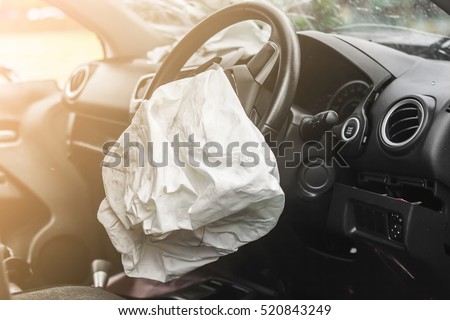 Airbag exploded at a car accident with illuminated