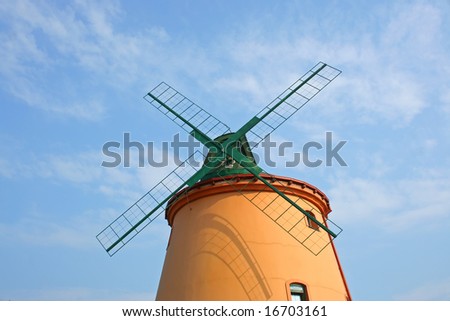 New windmill with four limbs on sky.