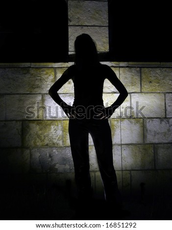 Mystery woman in the dark, back light and silhouette.