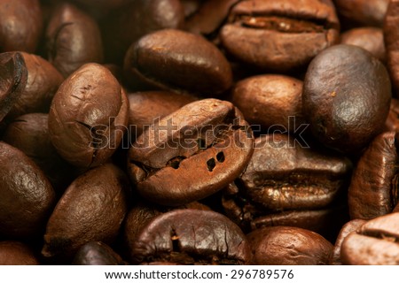 Closeup of coffee beans with focus on one / closeup with macro len of coffee beans