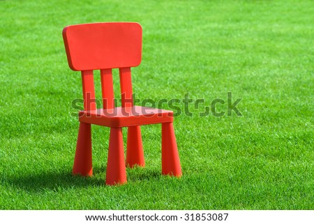 red chair on grass
