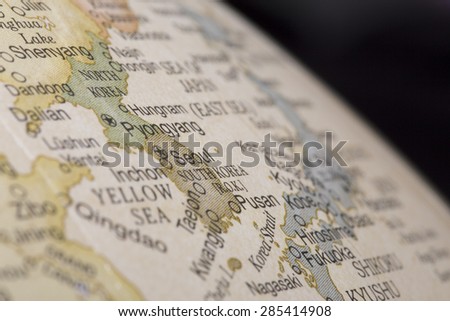 Macro of map of South Korea on a globe, narrow depth of field