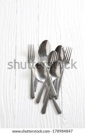 silver spoons on white table