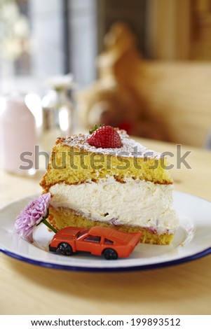 close up strawberry cream cake in coffee shop