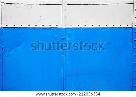 close up old blue and white metal wall