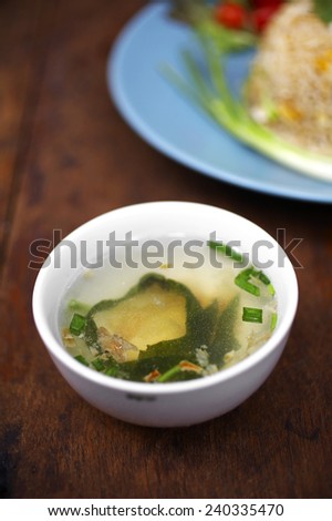 close up vegetable soup in white cup