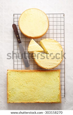 many cake in metal tray on white paper
