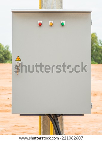 Electrical box with indicator lights on pole outdoor.