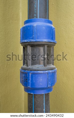 Pipe Screw Lock with Female Connector outdoor building on green background, Polyethylene pipe