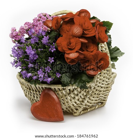 Colorful flower basket with different flowers and a red heart