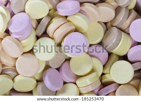 Colorful sherbet sweets to eat and as a background in yellow, pink and orange