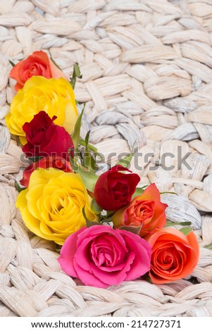 frame of roses blossoms of roses on a basket building a frame