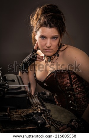 Thinking woman in steam punk outfit sitting at a table with a typewriter and a gun  pondering