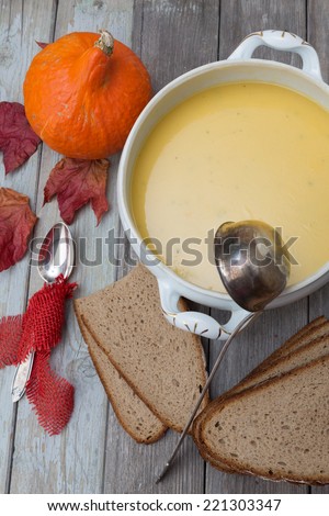 pumpkin soup set 2 a set of pumpkin soup with a pumpkin a spoon and a soup bowl