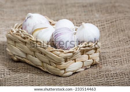garlic in basket on jute material