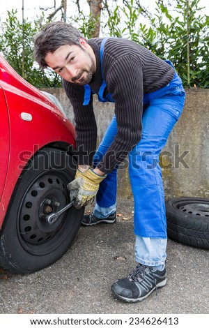 men at work - tire change with nut runner
