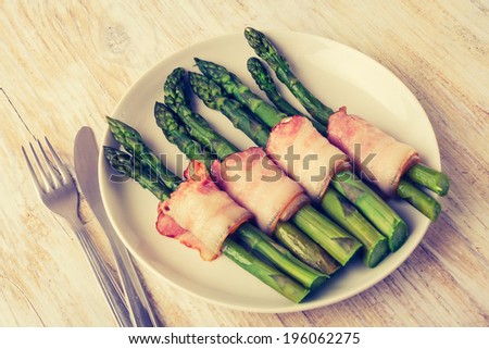 vintage photo of Green asparagus wrapped in ham