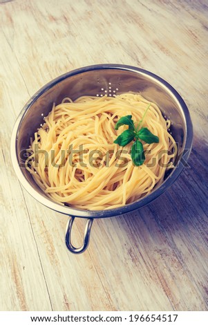 vintage photo of cooked pasta in the strainer