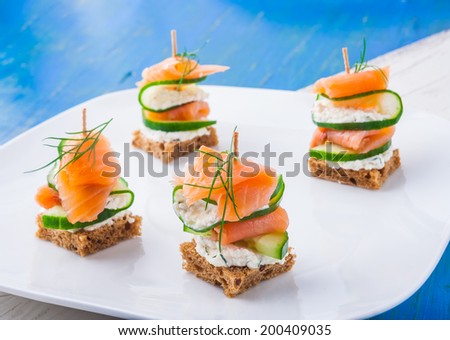 small sandwiches with salmon and cream cheese
