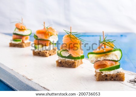small sandwiches with salmon and cream cheese