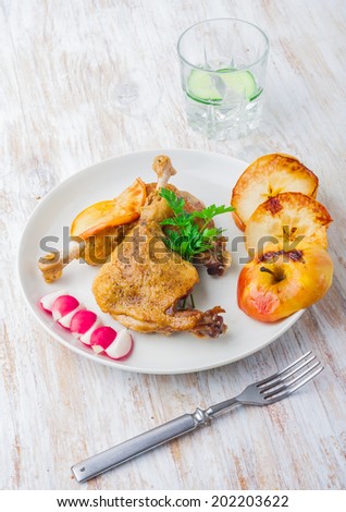 Roasted duck leg with apples