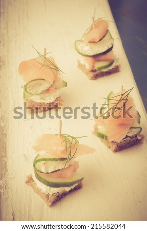 vintage photo of small sandwiches with salmon and cream cheese
