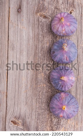 Fresh figs on a rustic wooden board