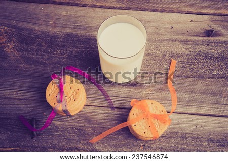 vintage photo of sweet cookies and glass of milk