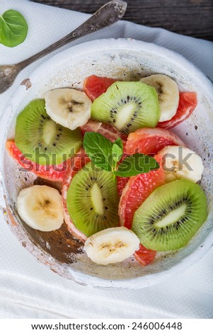Fresh fruit salad with kiwi, grapefruit and banana