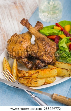 duck leg with roasted potatoes and fruit salsa