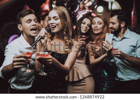 Selfie. Sing and Drink. Black Dress. Trendy Nightclub. Have Fun. Background. Cheerful. Smiling Girl. Singing Songs. Handsome Men. Beautiful Girls. Friends at Karaoke Club. Karaoke Club. Celebration.