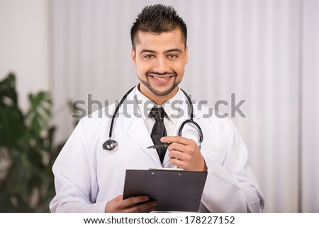 portrait of a young Indian doctor