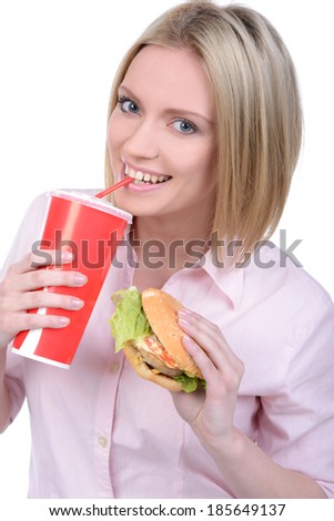 Young woman eating fast food isolated on white background
