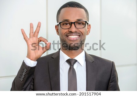 Portrait of young African businessman in office center