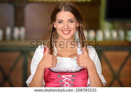 Portrait of beautiful sexy woman waiter in a pub beer