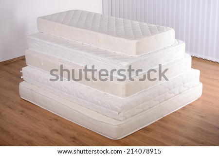 Many mattress in a pyramid in the room