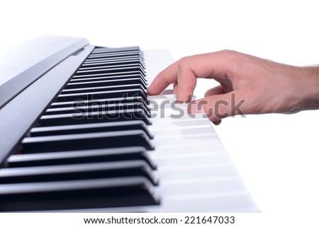 Male hands playing digital piano. Isolated over white background.