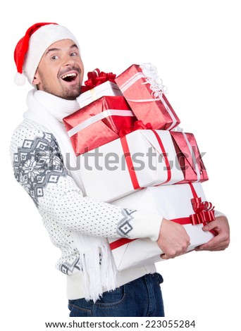 Happy smiling young man in Santa Claus hat with gift box, isolated on white background