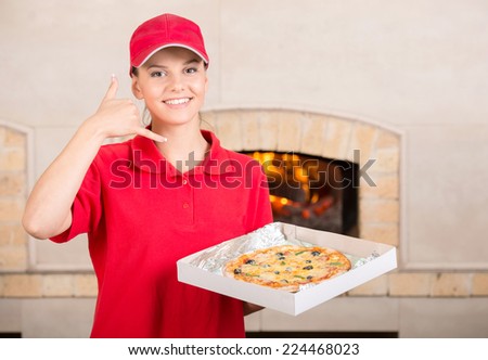 Delivery woman is holding the pizza box in hand and asking you to order pizza for delivery.