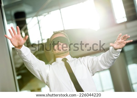 Concept of job search.  Portrait of young man blindfolded.