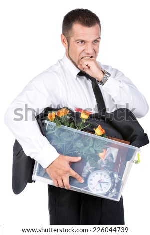Jobless young man in suit and box with office belongings fired from job isolated on white background. looking depressed, sad an in stress.