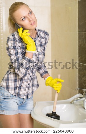 Young woman cleans the sink with air valves.
