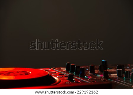 Dj mixer equipment to control sound and play music.
