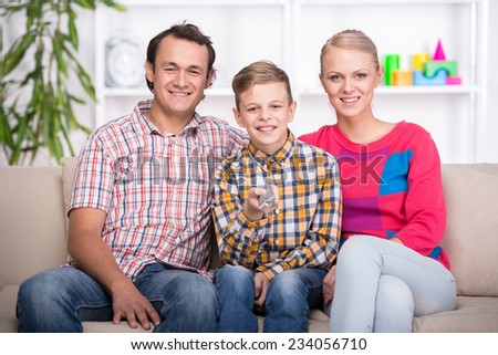 Portrait of young parents and son. Happy family.