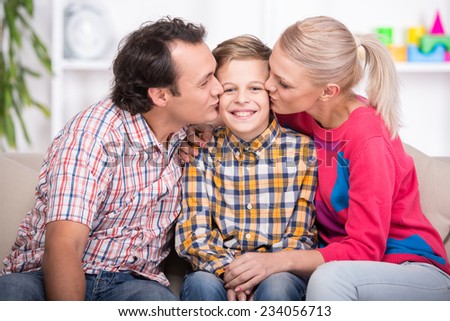 Portrait of young parents and son. Happy family.