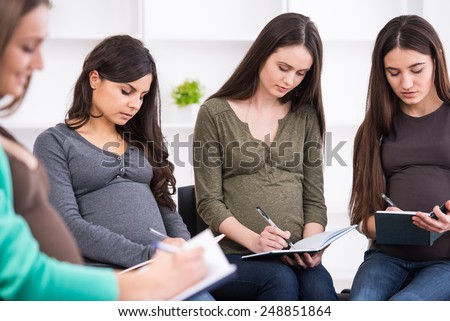 Young pregnant women together at antenatal class at the hospital.
