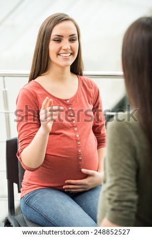 Maternity concept. Two smiling pregnant women at the meeting at antenatal class.