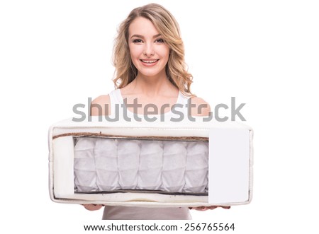 Young woman with nice, quality mattress that supported you to sleep well all night.