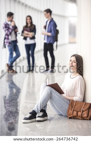 Female beauty young student reading a book.
