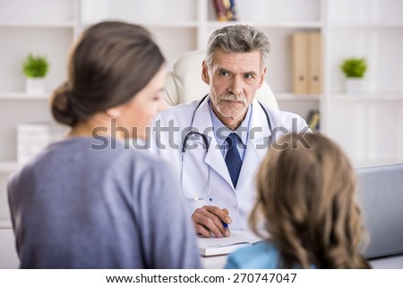 Little girl with her mother at a doctor on consultation.